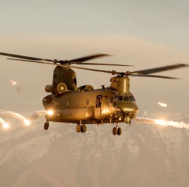 A Royal Air Force Chinook helicopter firing flares over Afghanistan.    Synonymous with operations in Afghanistan over the last thirteen years, the Chinook Force flew over 41,000 hours, extracted 13,000 casualties and its crews have been awarded numerous gallantry awards, including twenty three distinguished flying crosses for bravery in the air.
