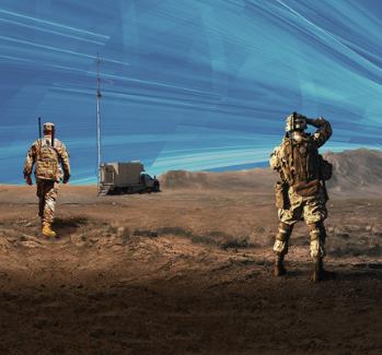 Two soldiers stand on the battlefield surveying the landscape