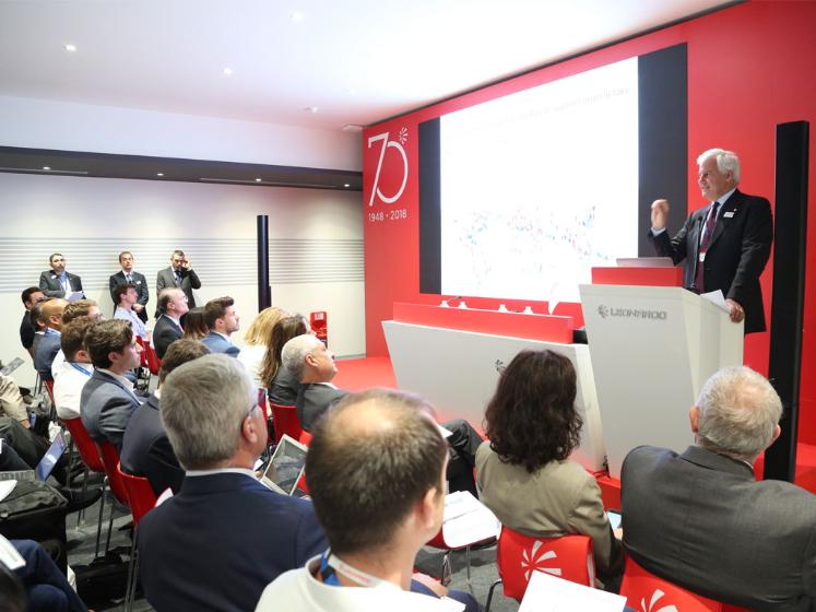 A. Profumo meets the financial community at the Air Show