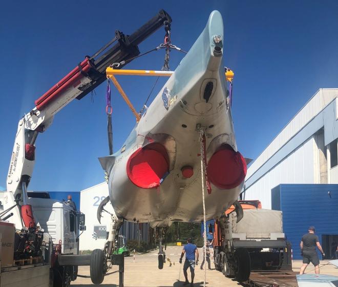 Loading the partially disassembled X616 in Venegono